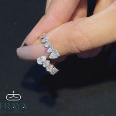 360° video of ERAYA pear-cut open band ring showing all sides and sparkle in hand