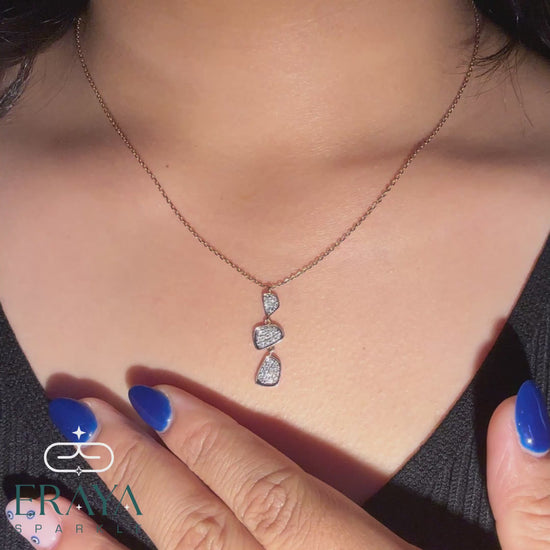 Model wearing lab grown diamond pendant and earring set