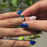 Blue gemstone engagement ring with ethical lab-grown diamonds