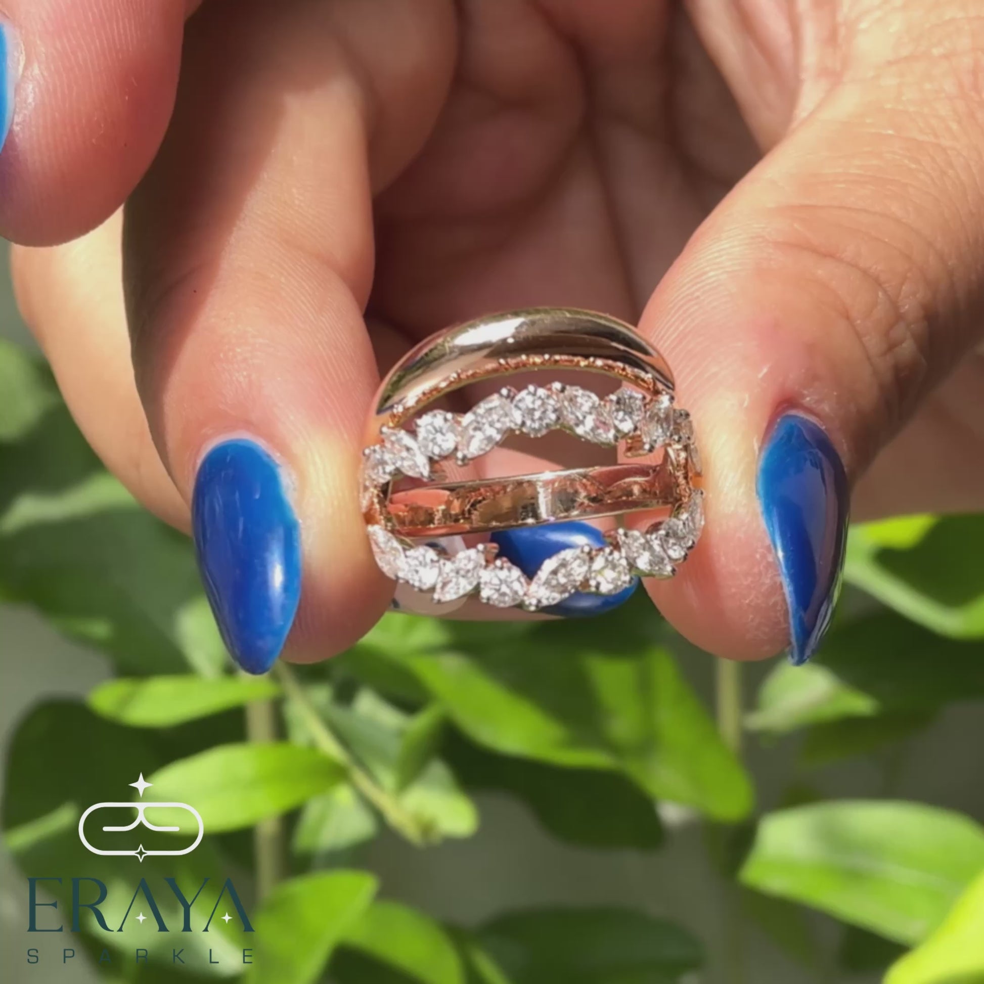 Angled shot of marquise and round diamond leaf ring showcasing sparkle and craftsmanship.