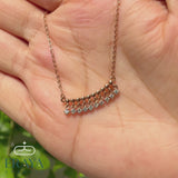 Video: 360° hands-on view of dangling diamond bar necklace showing lab-grown diamonds and rose gold chain