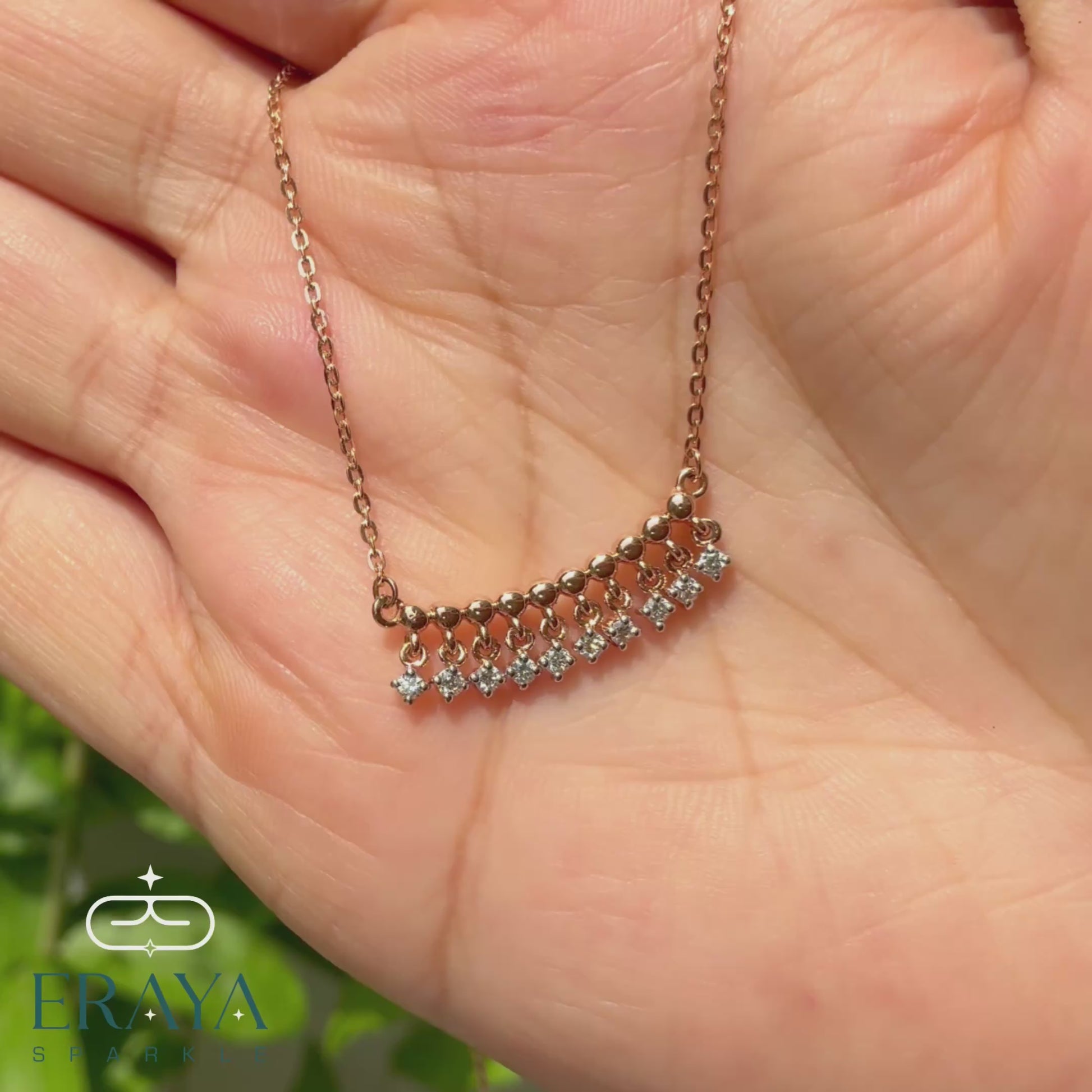 Video: 360° hands-on view of dangling diamond bar necklace showing lab-grown diamonds and rose gold chain