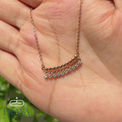 Video: 360° hands-on view of dangling diamond bar necklace showing lab-grown diamonds and rose gold chain