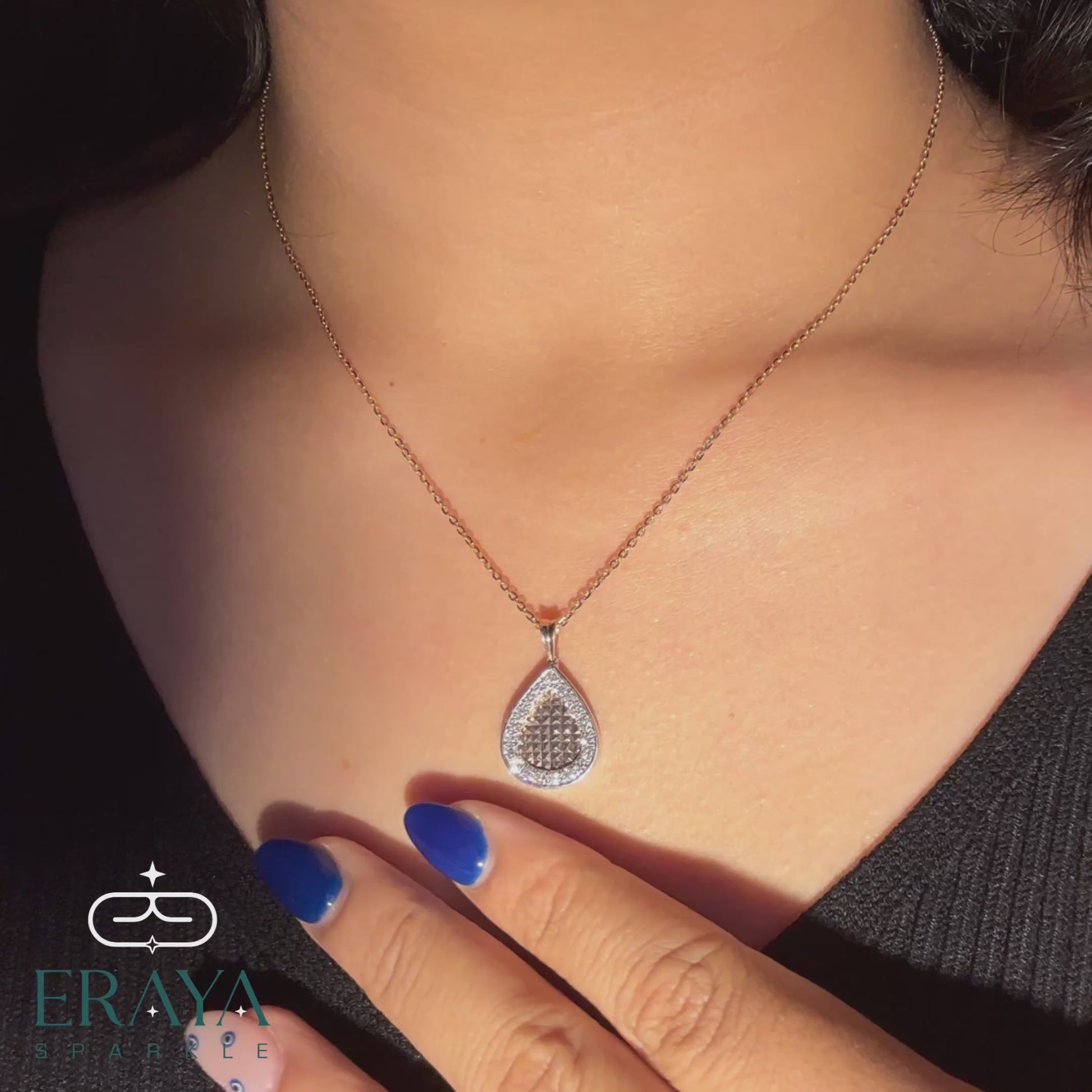 Model wearing rose gold teardrop diamond pendant and matching earrings set